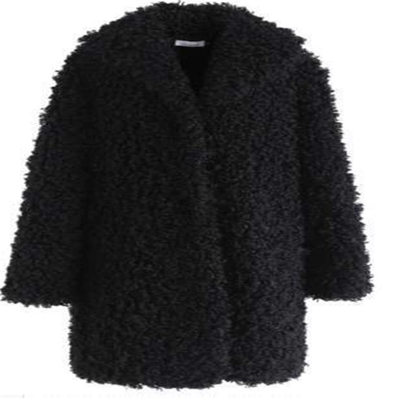 Women's fur coat side view showing Korean style silhouette