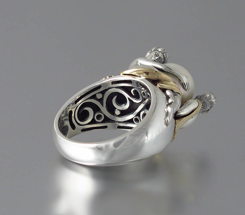 Elegant Lady Holding Black Pearl Two Tone Ring