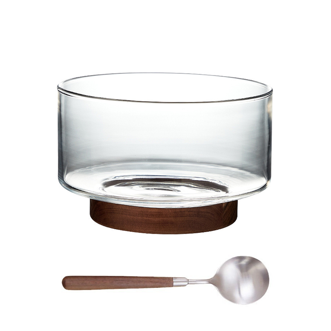 Clear glass bowl on a dark walnut wood pedestal base with a matching wooden spoon