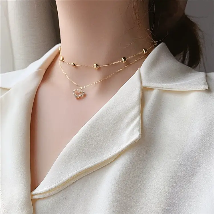 Gold multi-layered diamond necklace with love hearts