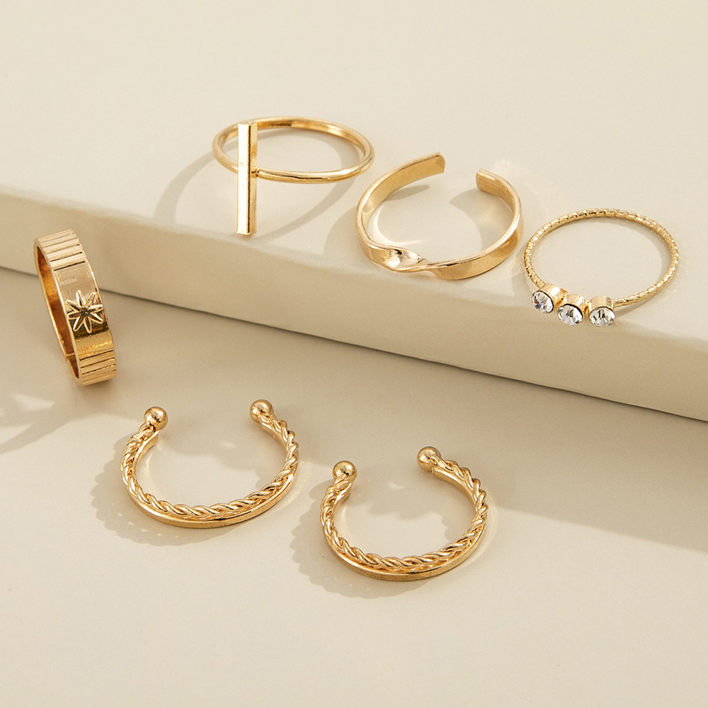 طقم ستة قطع من خواتم بتصميم نجمة هندسية بسيطة ذات ثمانية أطراف مرصعة بالألماس