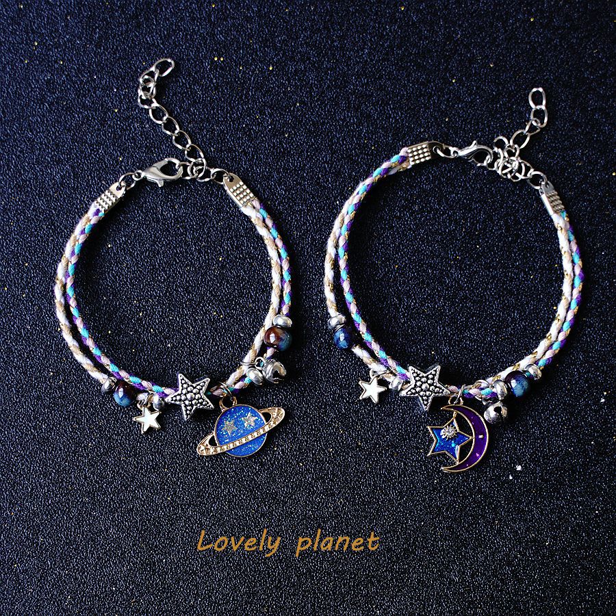 A Pair Of Women's Star And Moon Bracelets