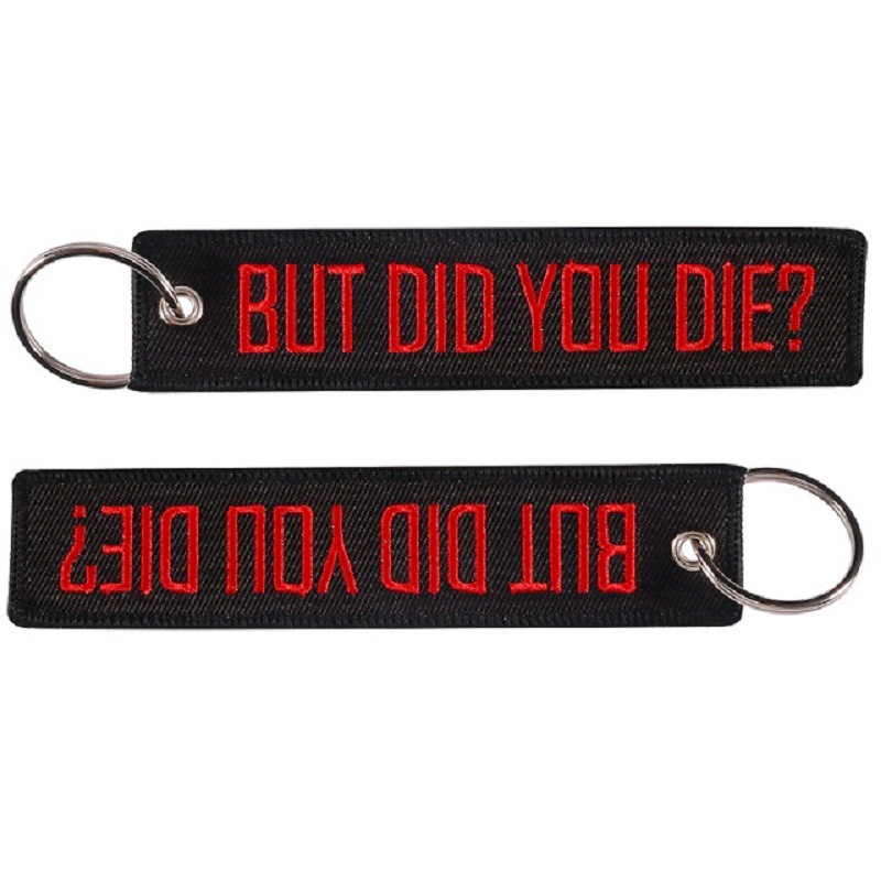 Embroidered Red Keychain On Black Background — image 1
