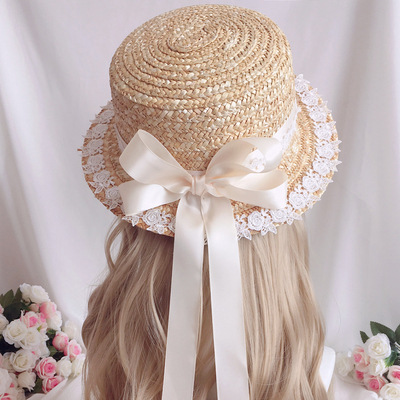 Straw hat with bow