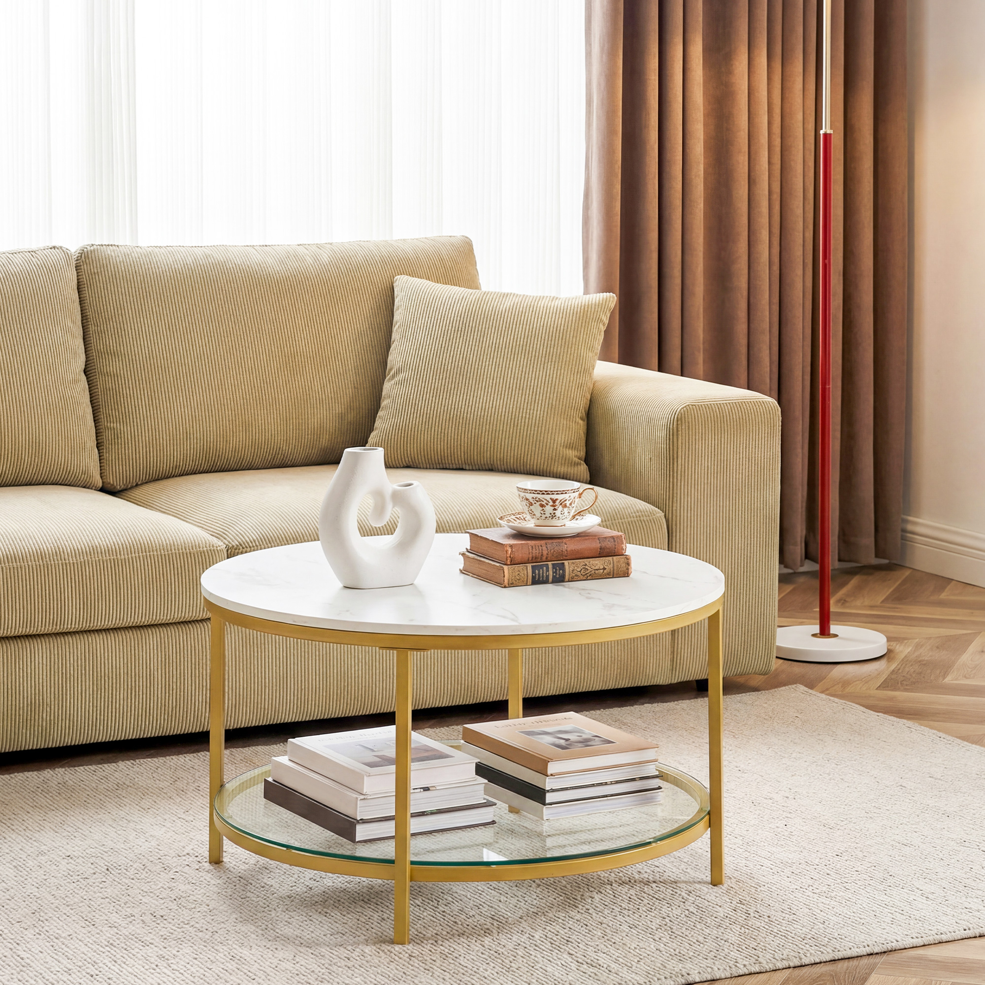 The Living Room Features A Marble Circular Glass Coffee Table, And A Double-layer Circular Transparent Coffee Table With Storage Function.