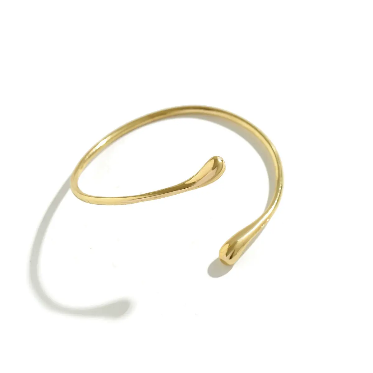 Handcrafted Gold-plated Geometric Cuff Bracelets And Boho-chic Metal Tassel Arm Rings With Vintage-inspired Exaggerated Water Drop Designs, Offering Unisex Luxu