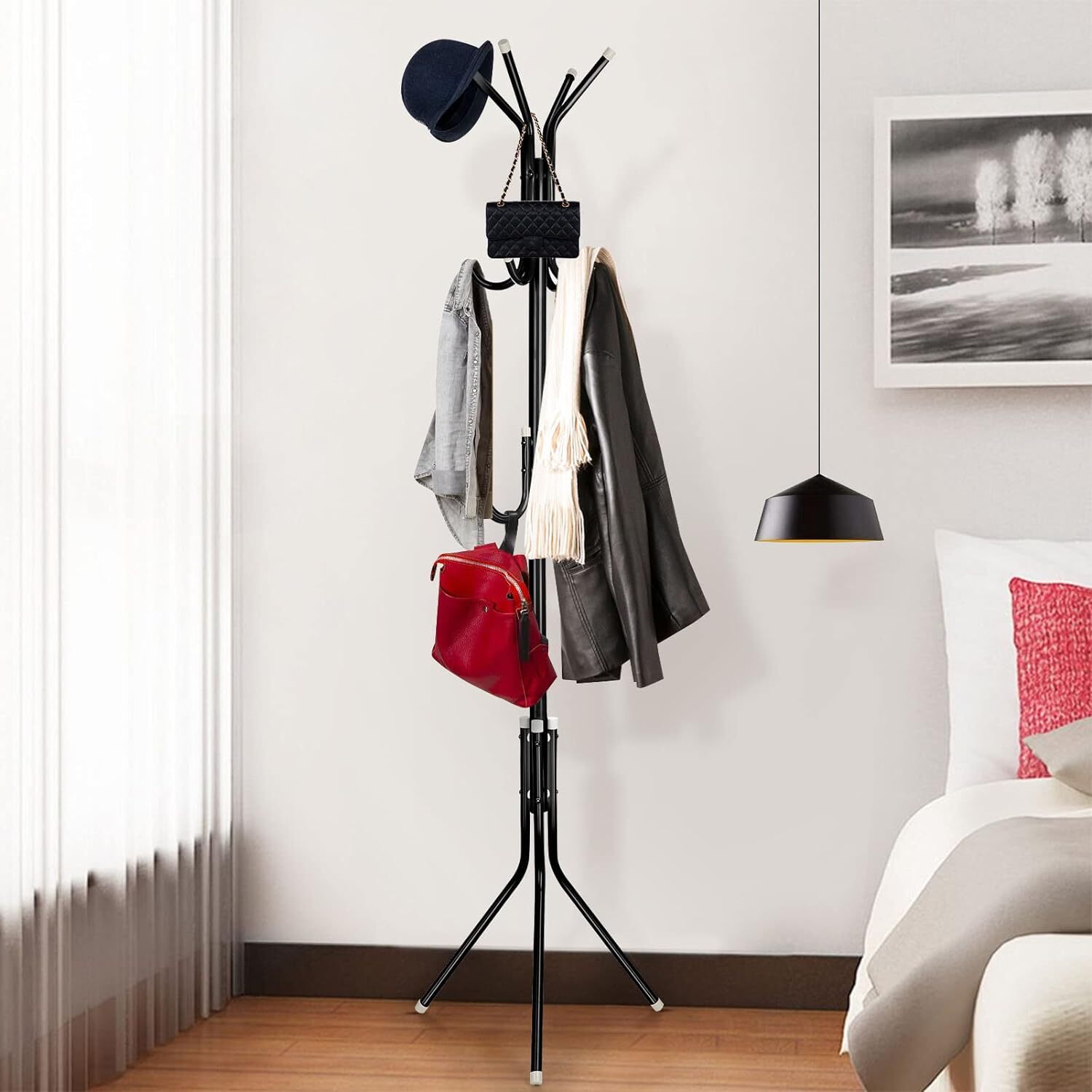 Tall black iron freestanding coat stand with 12 hooks and a tripod base