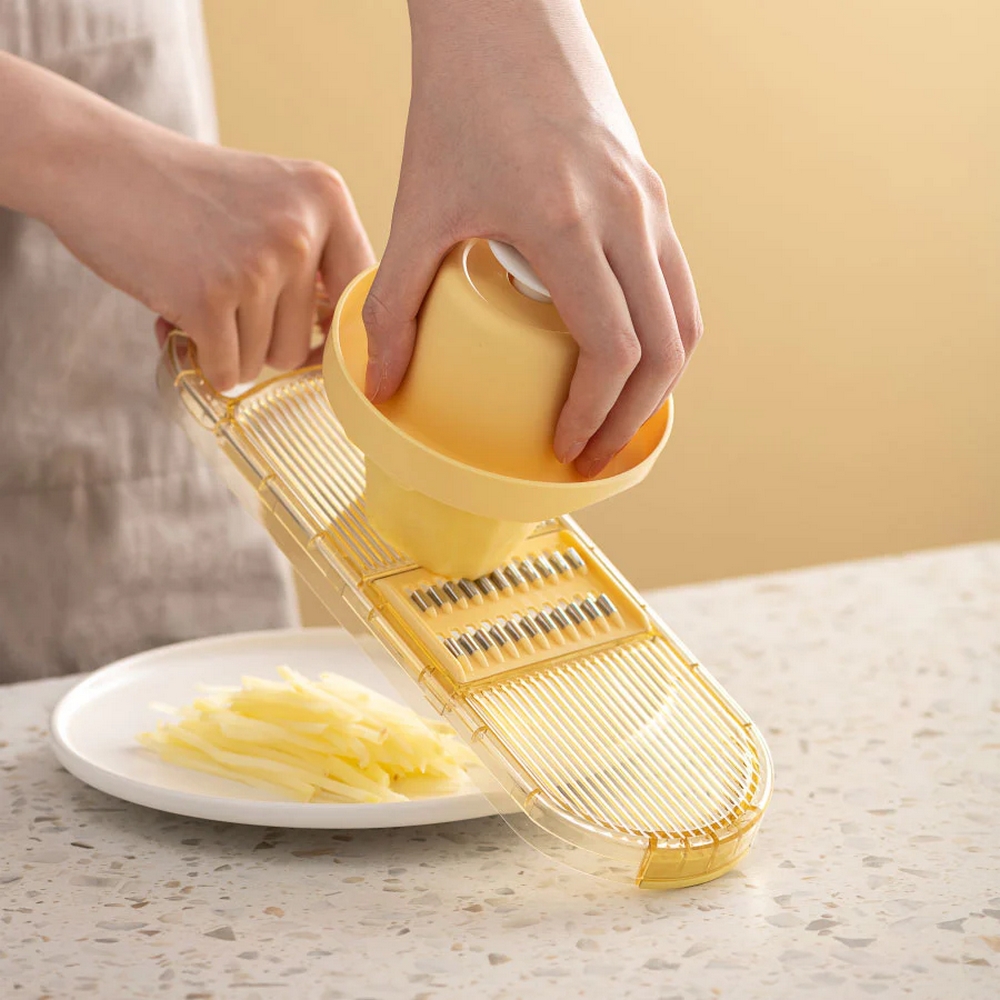 Mandoline slicer with large bowl and 6 blades