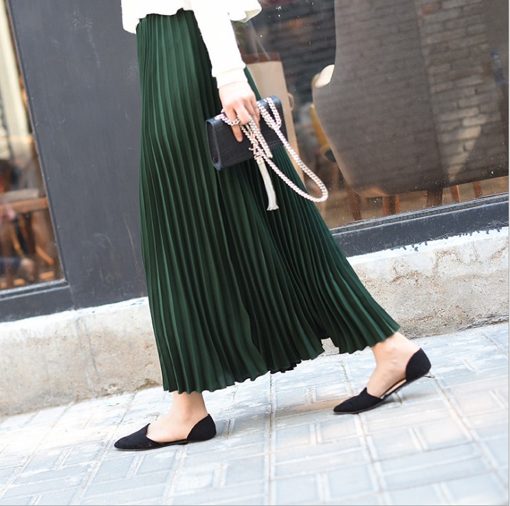 Title 10, Solid color pleated skirt offers effortless sty...