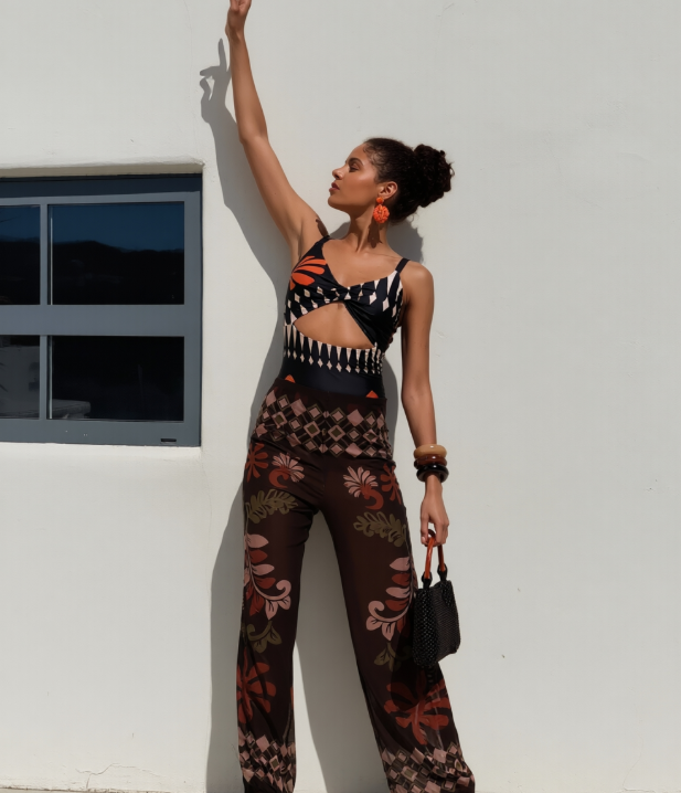 Women's 2-piece beach swimwear set close-up fabric texture and hollow-out detail print