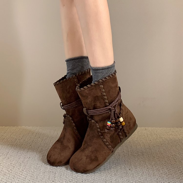 Women's suede ankle boots – tassel detail and mid-calf shaft close-up