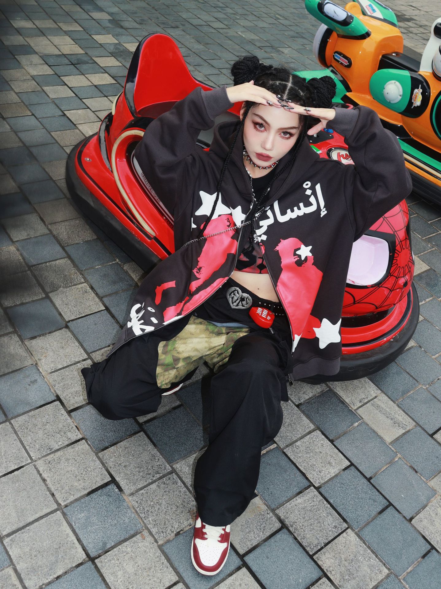 Couple Wearing Graffiti Offset Sweatshirt