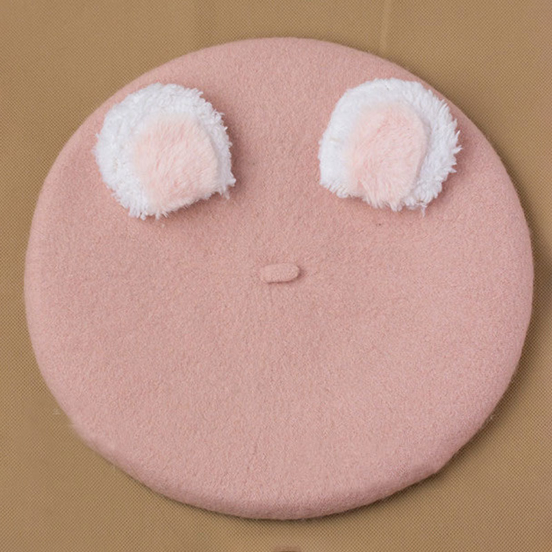 Pink hat white ear rear ear