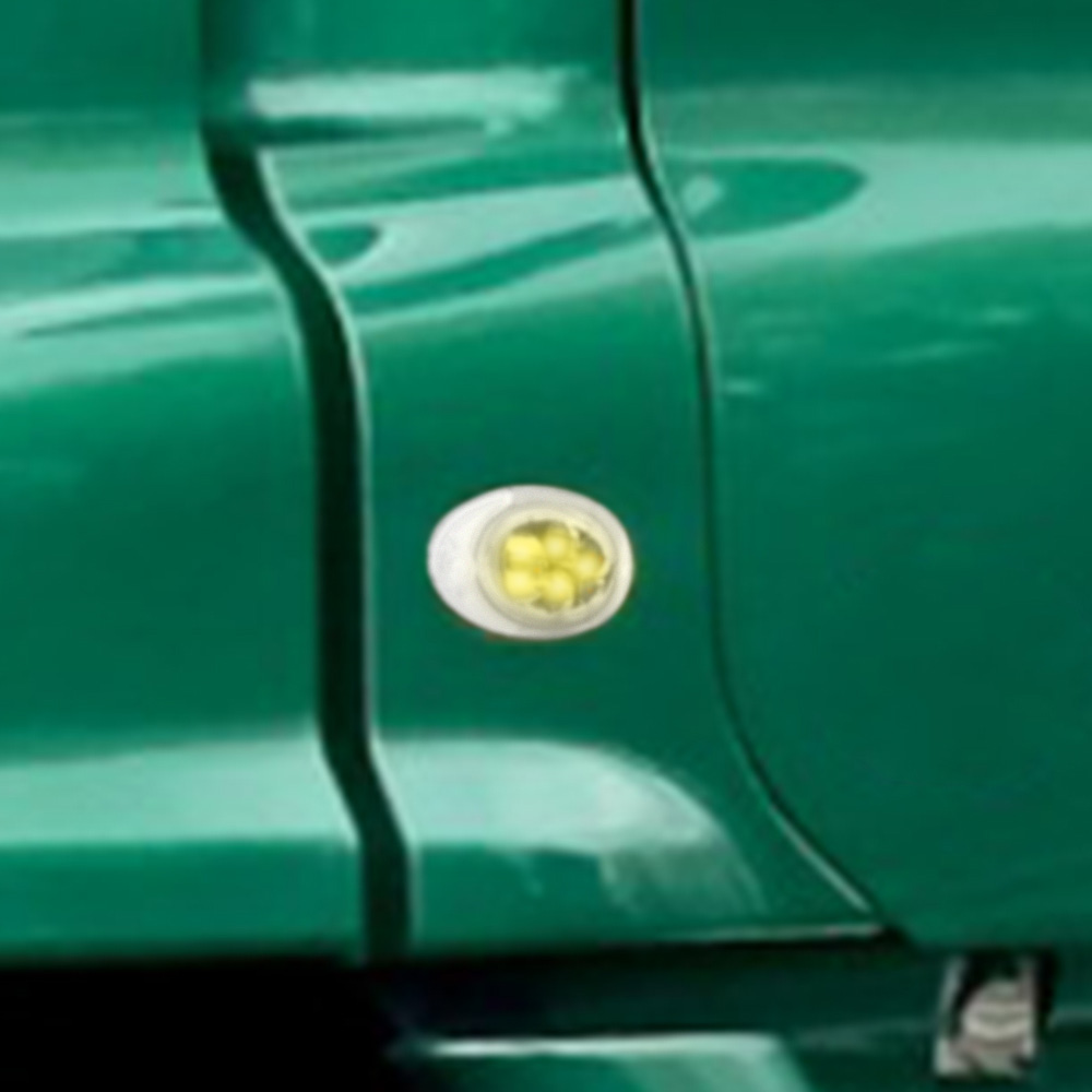 Freightliner Cascadia LED side marker light installed on driver side cab showing amber illumination