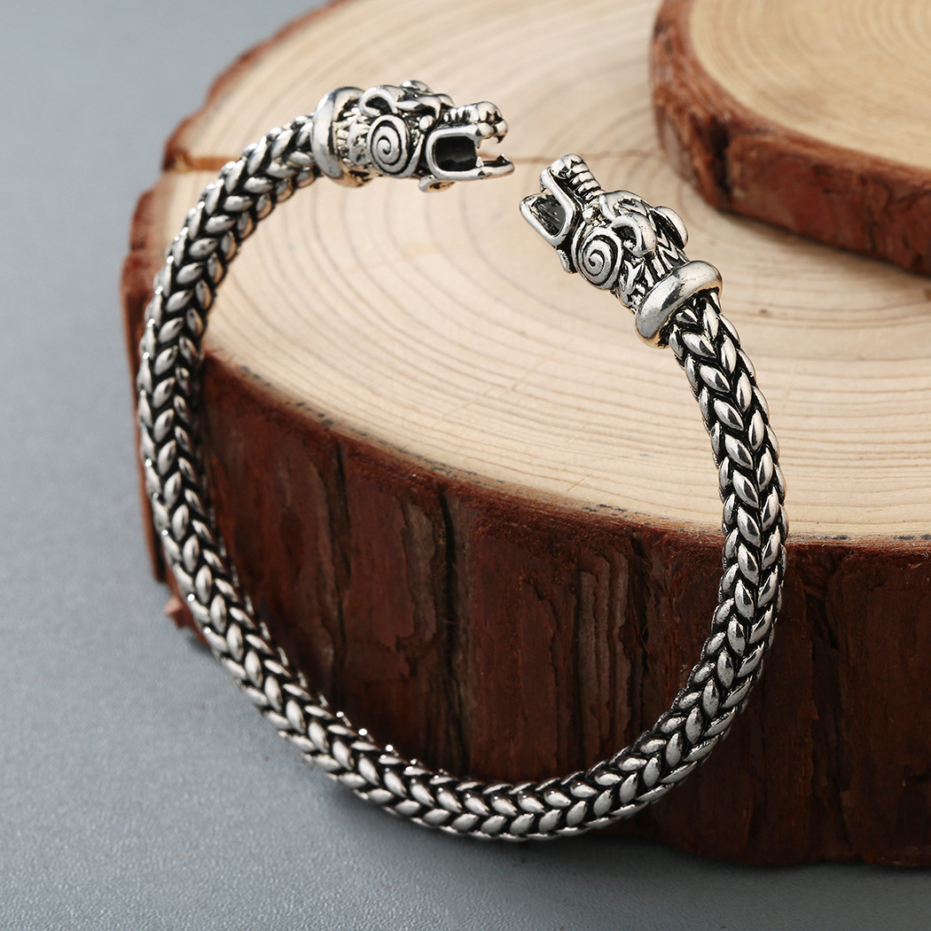 Asgard Crafted Small Handcrafted Stainless Steel Grey Wolf Head Torc Bracelet - Image of the bracelet crafted with stainless steel featuring a grey wolf head design.