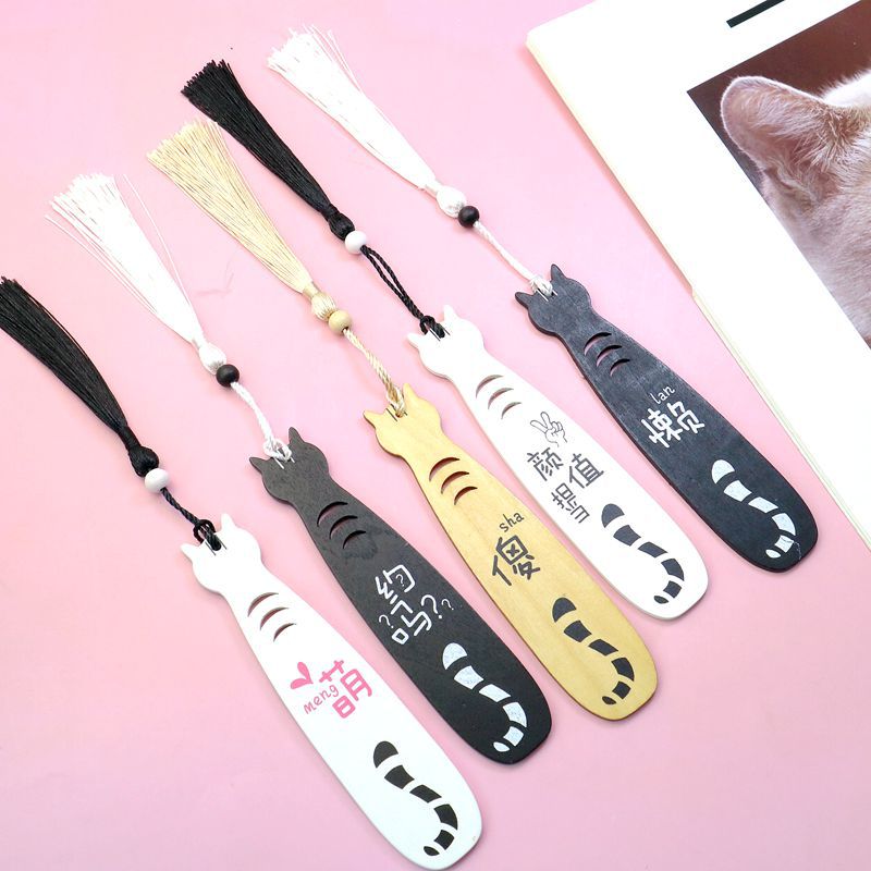 Five cat bookmark designs displayed together showing personality variations