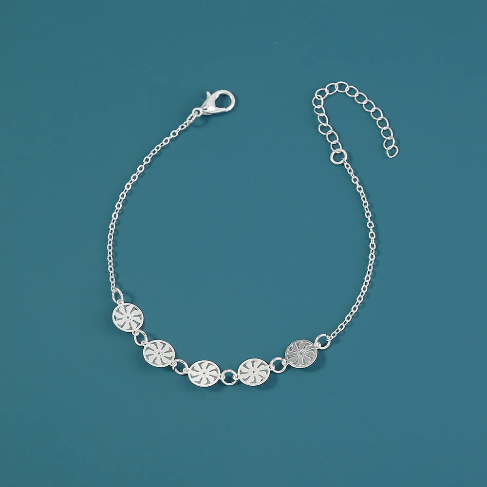 Cyclonic silver bracelet that glows in the dark.