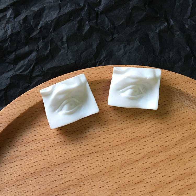 Abstract Three-dimensional Human Face Ears Eyes Mouth Earrings