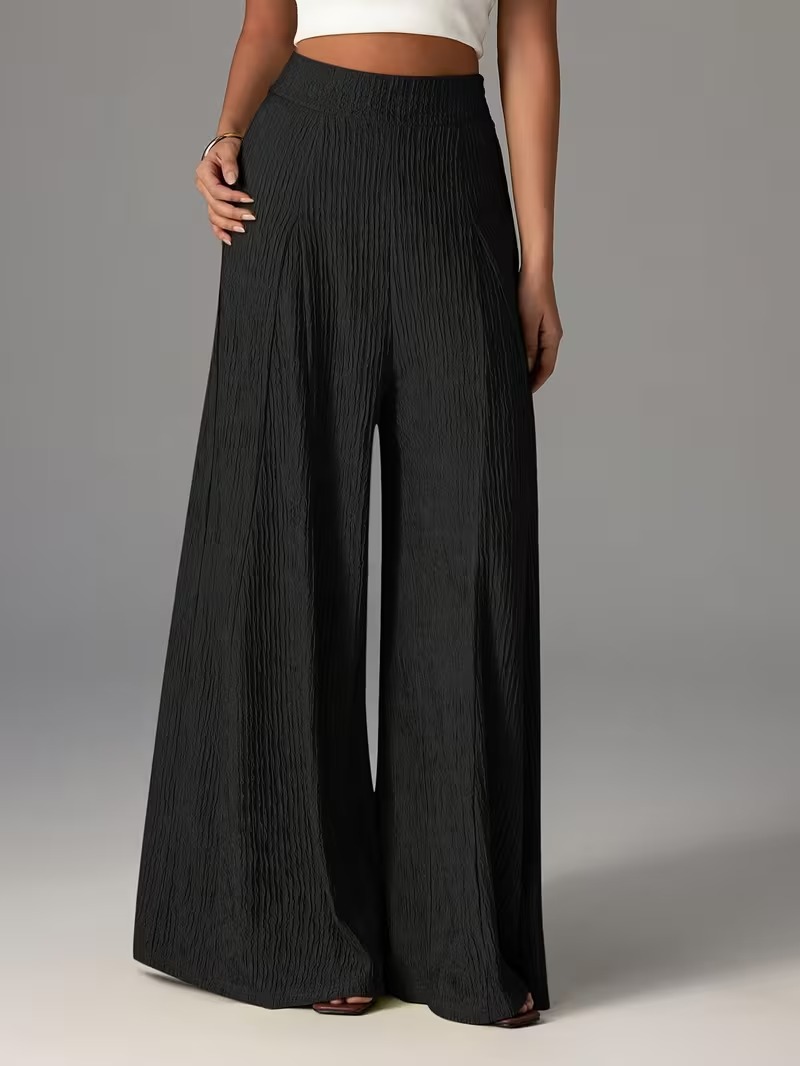 Pantalones holgados de color liso con cintura elástica y talle alto. 00b47089 8e1c 4dc7 8cb0 B1e4926f815f