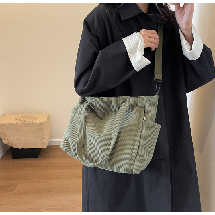 Large Capacity Art Student Shoulder Bag. Product information: Lining texture: Polyester, Applicable scenario: leisure travel, Color: creamy-white, green, black, Outer bag type: Sandwich pocket, Hardness: medium and soft, Material: corduroy, Suitcase shape