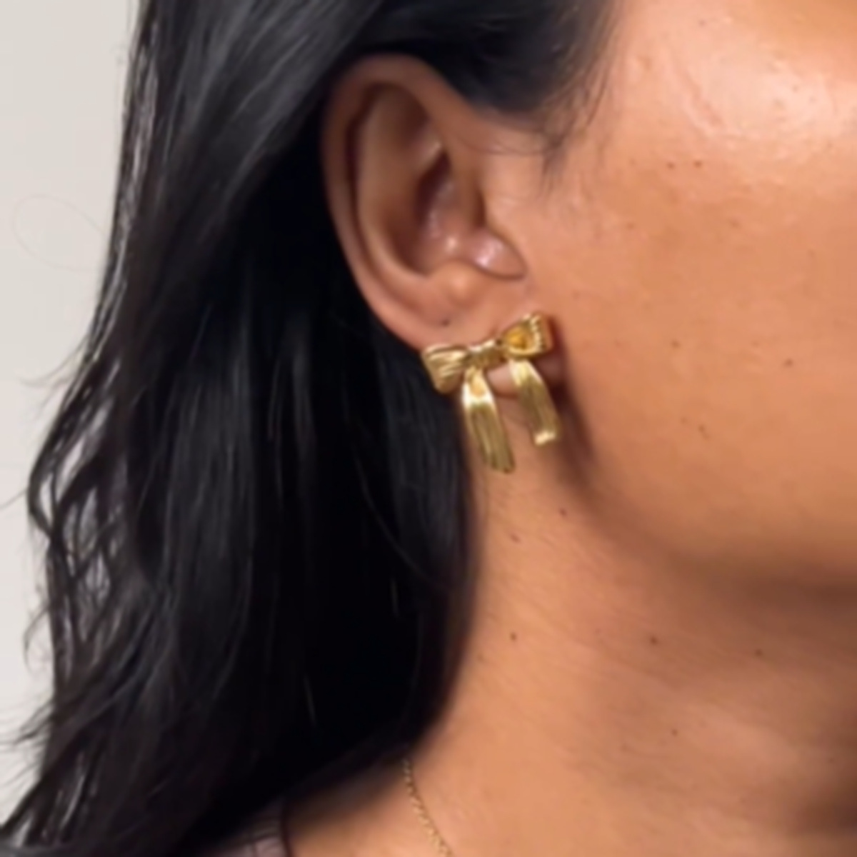 Female Bow 16k Gold Titanium Steel Earrings