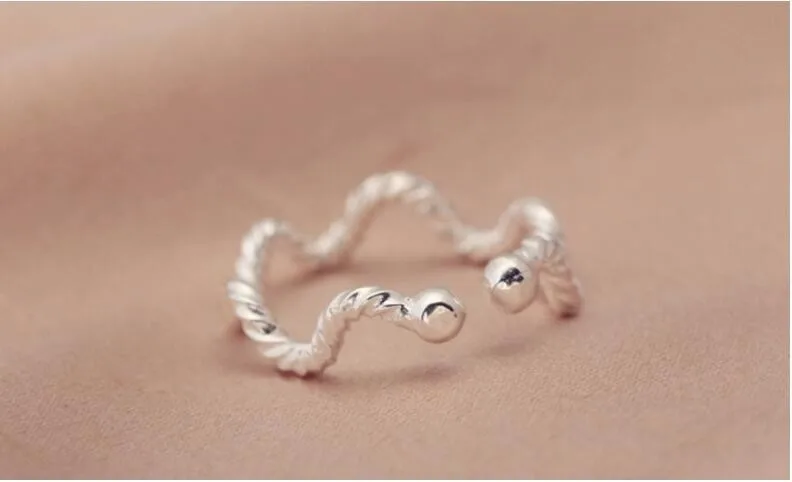 Title 2, Wave Twist Ring voor dames Elegantie en modern ...