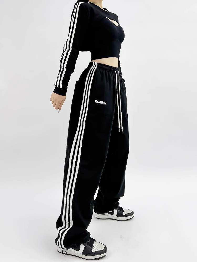 Athletic wide-leg pants, model wearing lifestyle photo showing full length silhouette