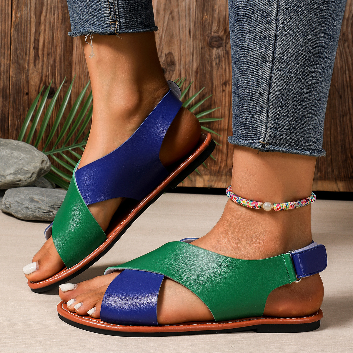 Women's color-block cross-strap flat sandals in Black – Velcro closure flat sandal, top view showing cross-strap pattern and round toe