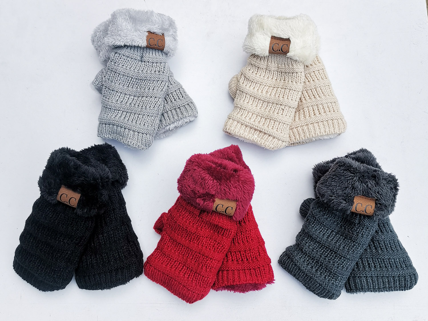 A collection of five pairs of European and American wool knitted turn-over labeling touch screen gloves, crafted from soft acrylic fiber with a faux fur lining. These gloves are available in a range of colors including gray, beige, black, red, and dark gray. Each glove is enhanced with a small brown label and is displayed on a white background.