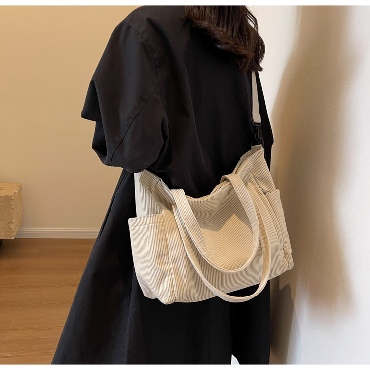 Large Capacity Art Student Shoulder Bag. Product information: Lining texture: Polyester, Applicable scenario: leisure travel, Color: creamy-white, green, black, Outer bag type: Sandwich pocket, Hardness: medium and soft, Material: corduroy, Suitcase shape