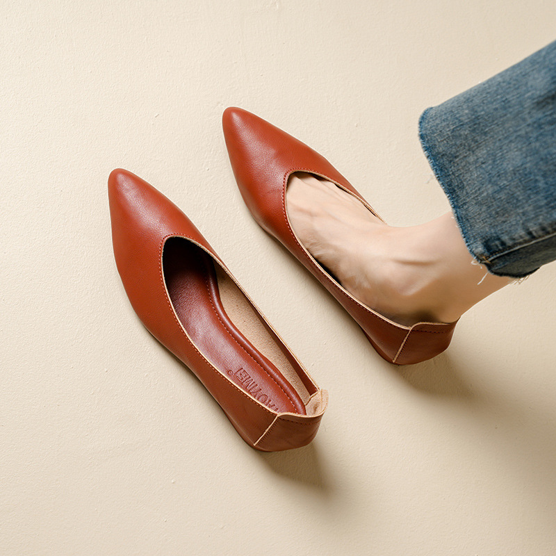 A Woman With Thick Heels Pointed Toes And Single Shoes