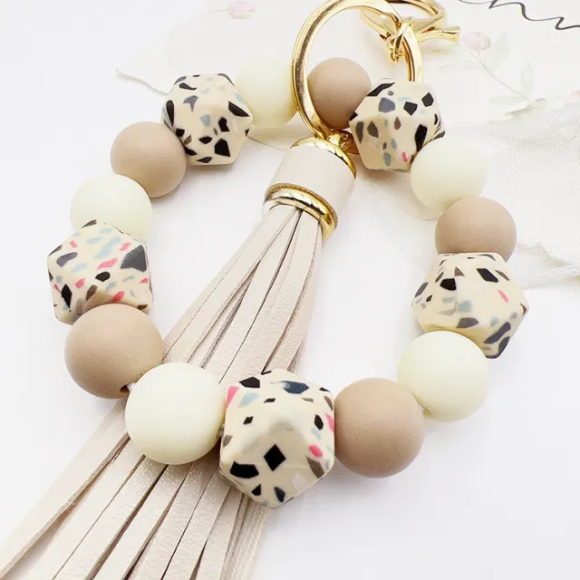 Silicone Octagonal Oak Tassel Key Chain Beige Millstone K306 - Shop at LoveMi