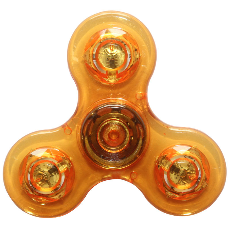 Rotating fingertip gyroscope glowing plastic (transparent