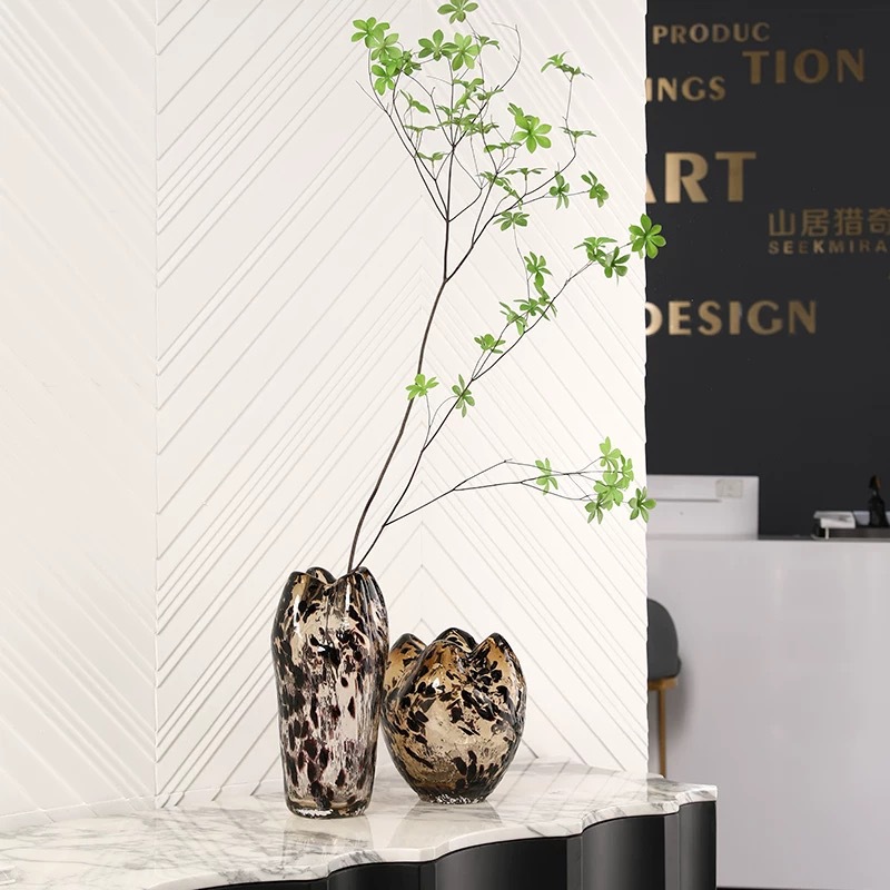 A Variety Of Modern Glass Vases And Floral Arrangements For Showroom Displays And Home Decor