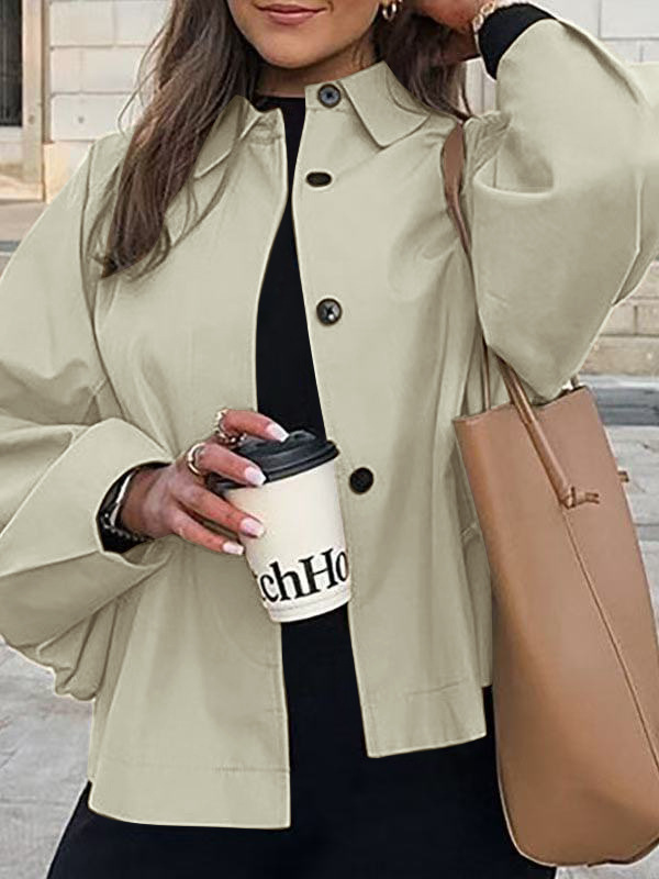 Women's trench coat – collar and button detail close-up