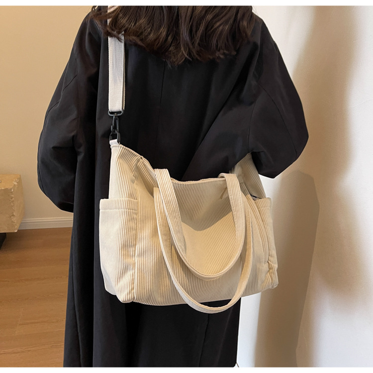 Large Capacity Art Student Shoulder Bag. Product information: Lining texture: Polyester, Applicable scenario: leisure travel, Color: creamy-white, green, black, Outer bag type: Sandwich pocket, Hardness: medium and soft, Material: corduroy, Suitcase shape