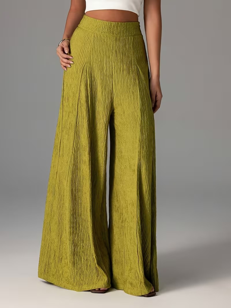 Pantalones holgados de color liso con cintura elástica y talle alto. 1d0072be 0015 4df3 B6d4 1e0adc174a42