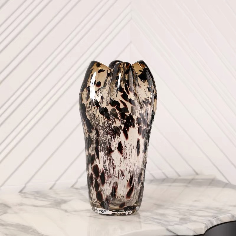 A Variety Of Modern Glass Vases And Floral Arrangements For Showroom Displays And Home Decor