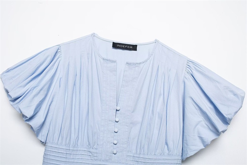 Women's ruffle-trim blouse in white – slim-fit sleeveless elegant commute top