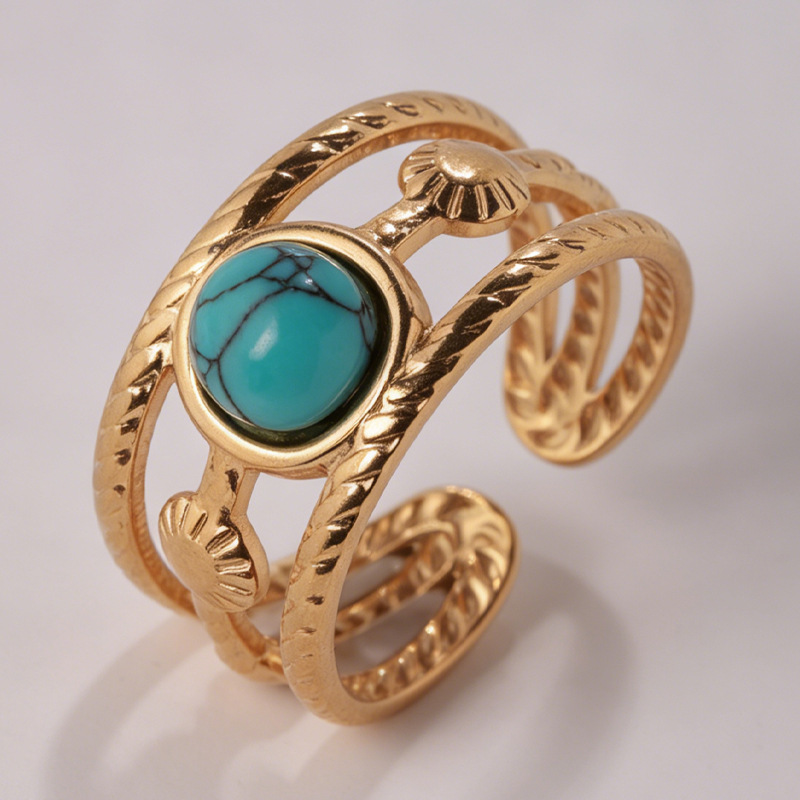 Gold wide-band turquoise adjustable ring showing twisted rope texture detail
