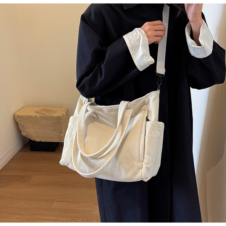 Large Capacity Art Student Shoulder Bag. Product information: Lining texture: Polyester, Applicable scenario: leisure travel, Color: creamy-white, green, black, Outer bag type: Sandwich pocket, Hardness: medium and soft, Material: corduroy, Suitcase shape