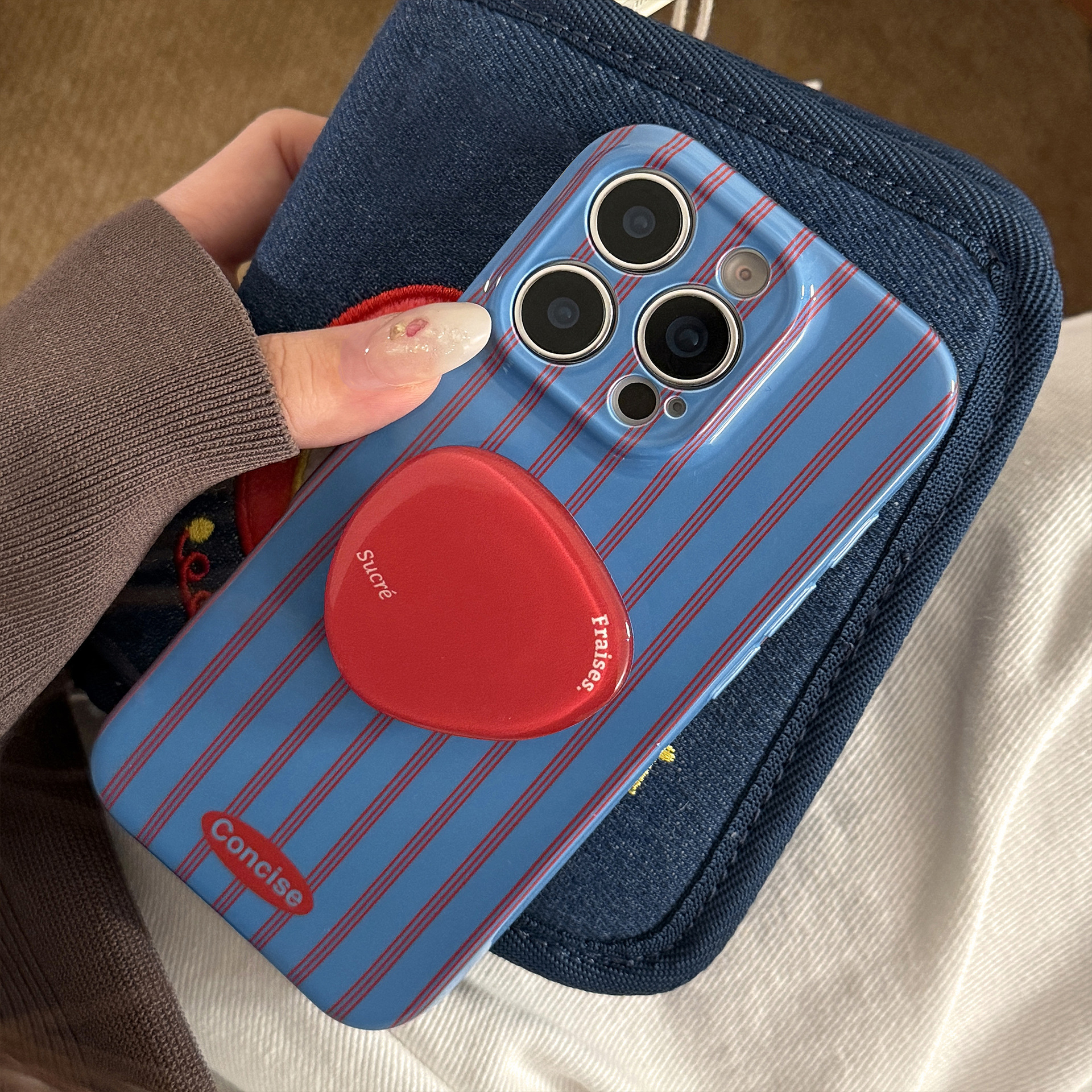 Red And Blue Striped Phone Case With A Retro Film-inspired Design And A Personalized Stand For Full-body Protection