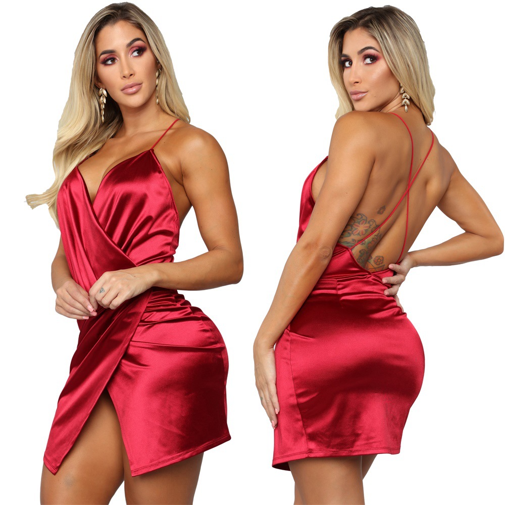 Tina's Crisscross Ruched Tulip Hem Satin Mini Dress  Product Details:  Unleash Your Inner Icon 💋  Step into the spotlight and own the night with Tina's Crisscross Ruched Tulip Hem Satin Mini Dress. This isn't just a red dress; it is a statement of confidence and allure. Designed for the woman who isn't afraid to turn heads, this piece captures the essence of modern glamour with a sultry twist. Whether you are hitting the most exclusive club in the city, enjoying a romantic candlelit dinner, or celebrating a milestone with cocktails, this satin masterpiece ensures all eyes remain on you. The lustrous red fabric catches the light with every movement, creating a fluid, liquid-gold effect that is impossible to ignore.