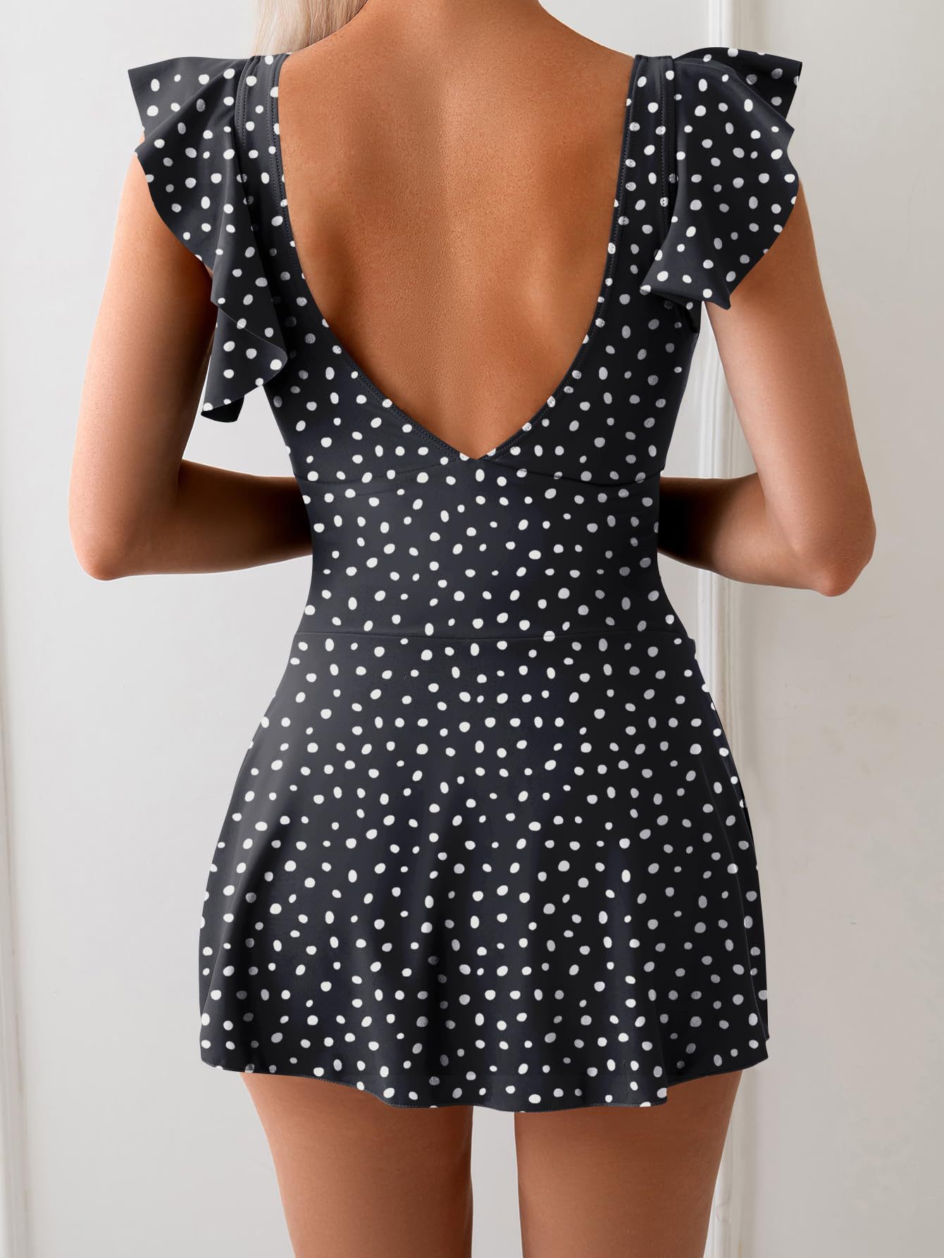 Women's one-piece swimsuit in red flower print, bold beach lifestyle photo