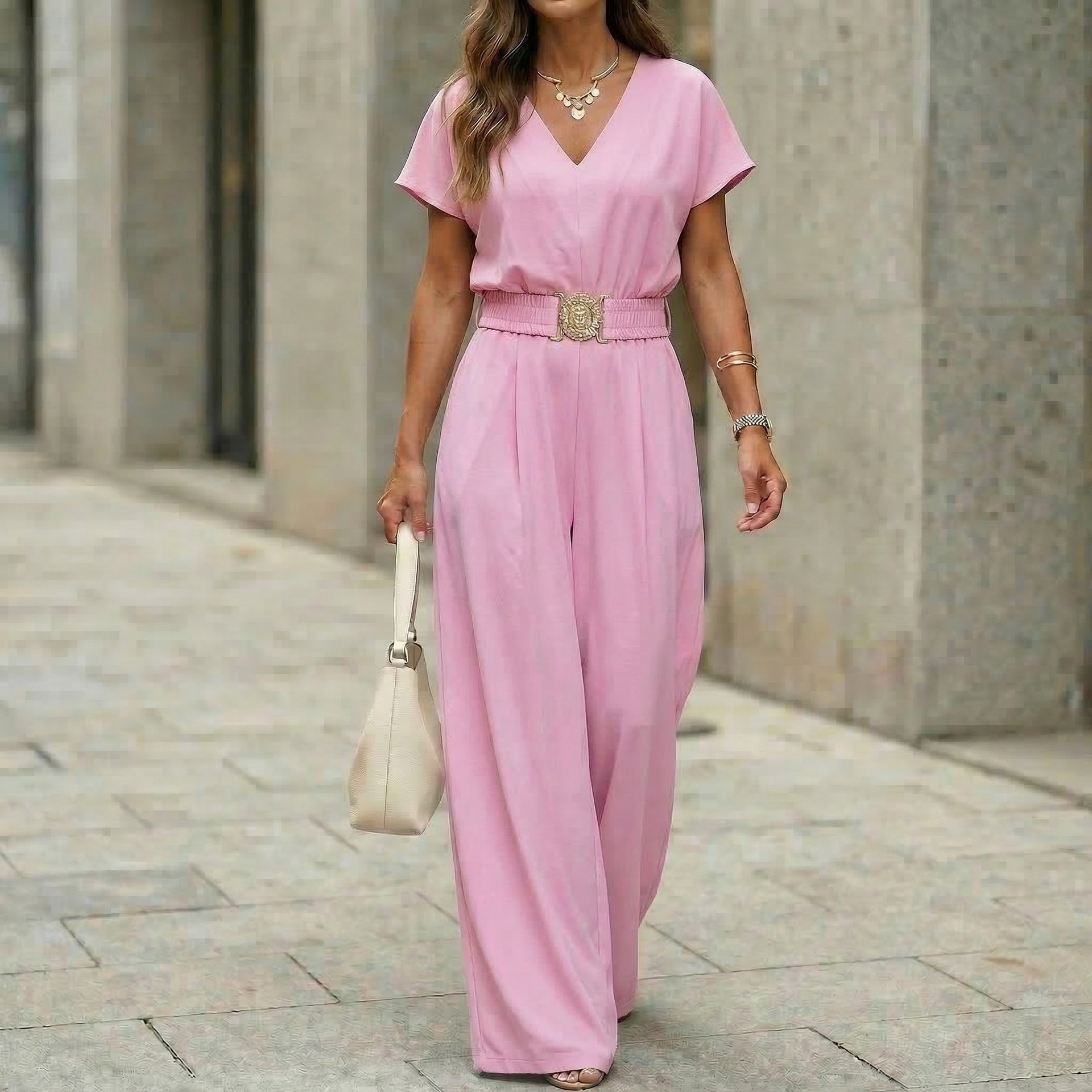 Women's belted wide-leg jumpsuit in pink, full length view showing wide-leg drape