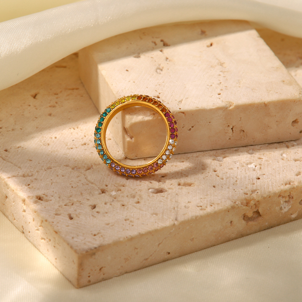 Title 3, Gold-plated stainless steel ring with inlaid co...