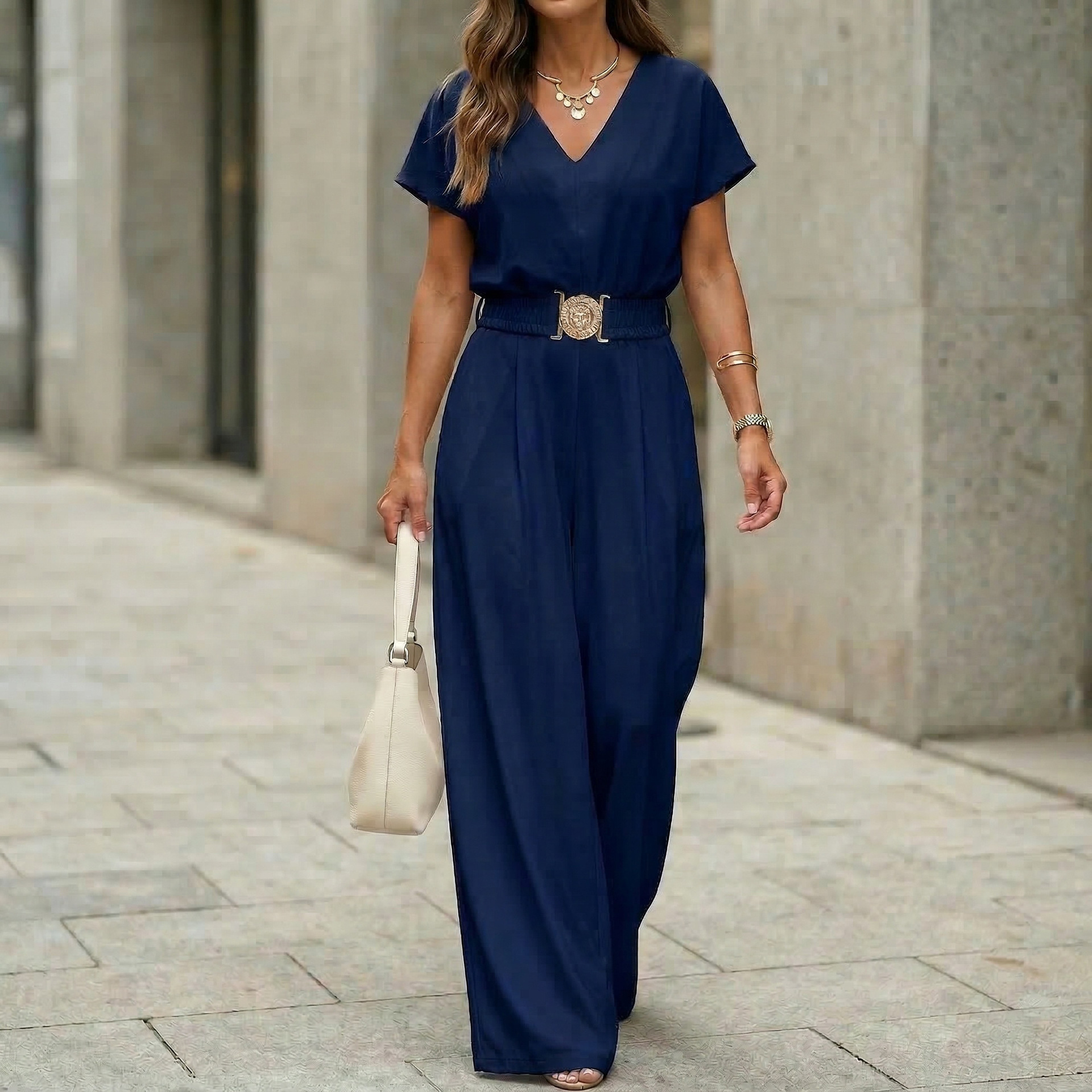 Women's V-neck jumpsuit in navy blue, styled for office wear
