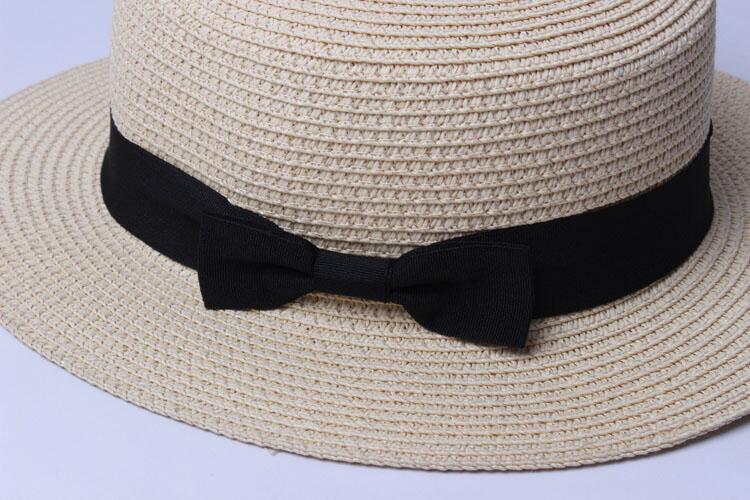 Title 7, Sun hat with bow covering the sun