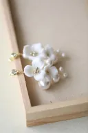 A Pair Of Silver Earrings