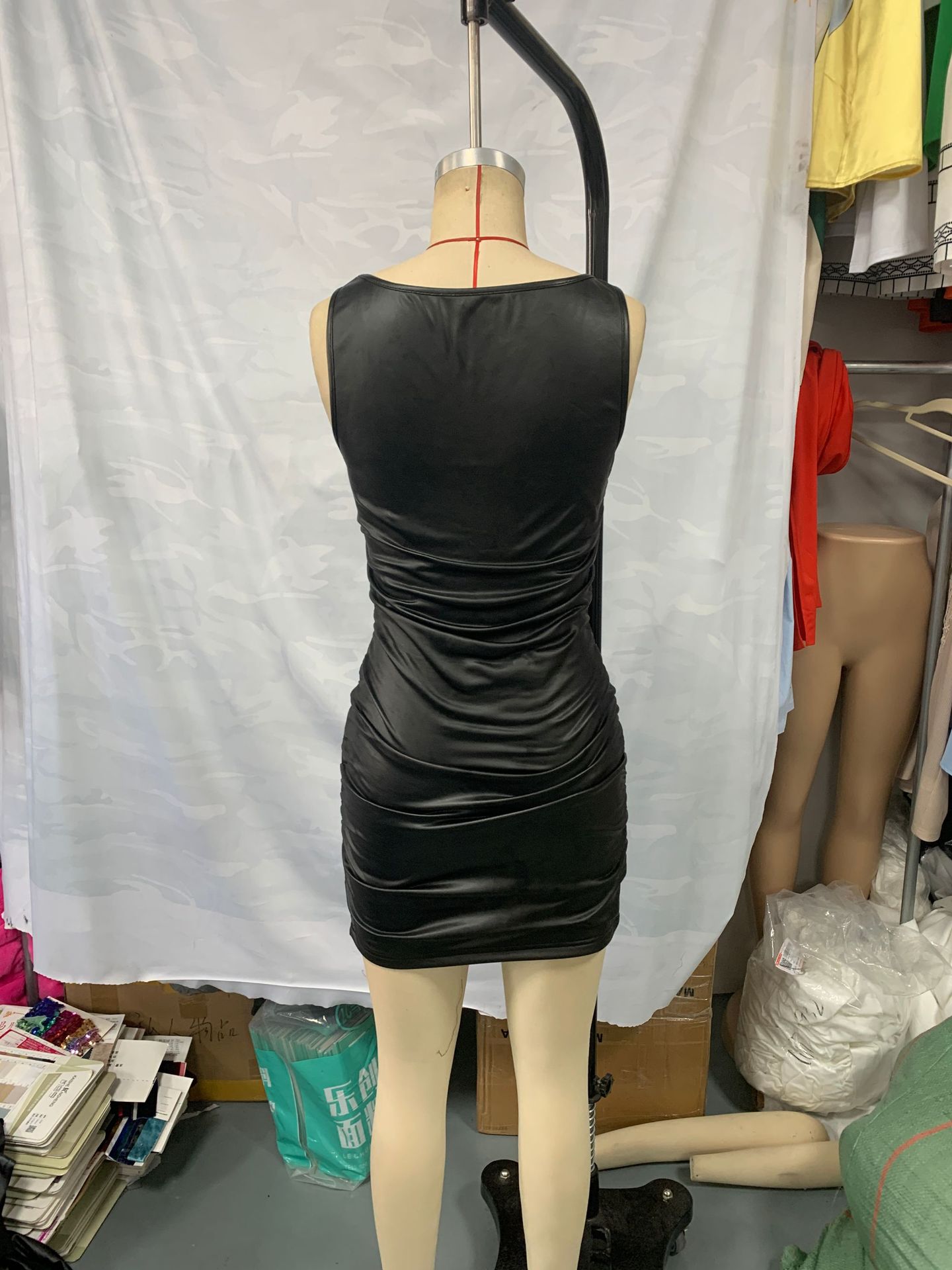 black slip dress high waist detail side angle showing elegant drape and straps